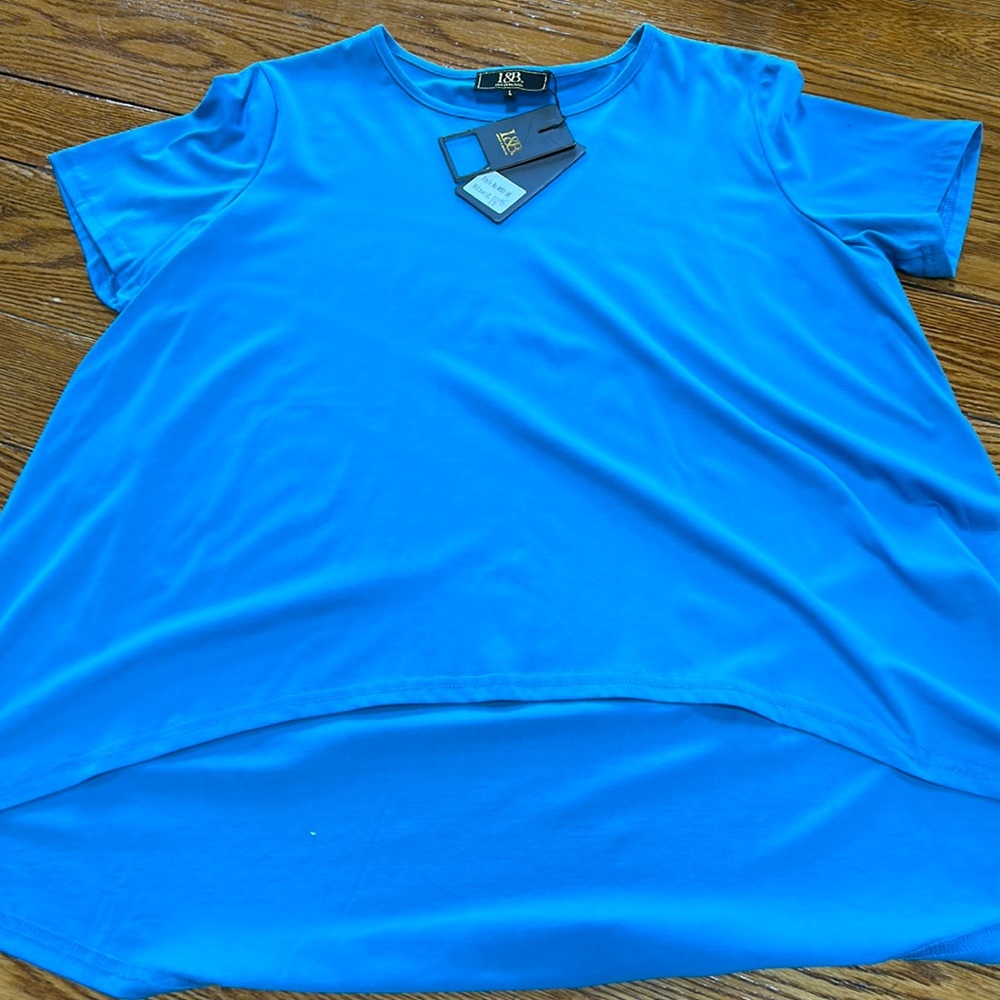 Lucky & Blessed turquoise short sleeve blouse.  Hi-low hem.  New w/tags. Large.